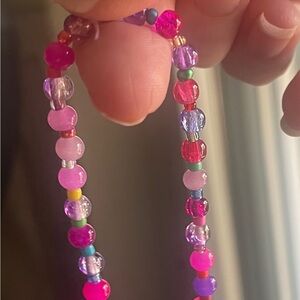 Vibrant Multicolor Pink And Purple Beaded Bracelet With A Pop Of Color Between
